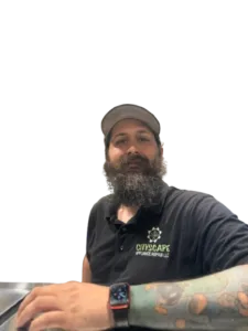 Paul Hartland from Cityscape Appliance Repair LLC in uniform, smiling, with a beard and tattoo visible.